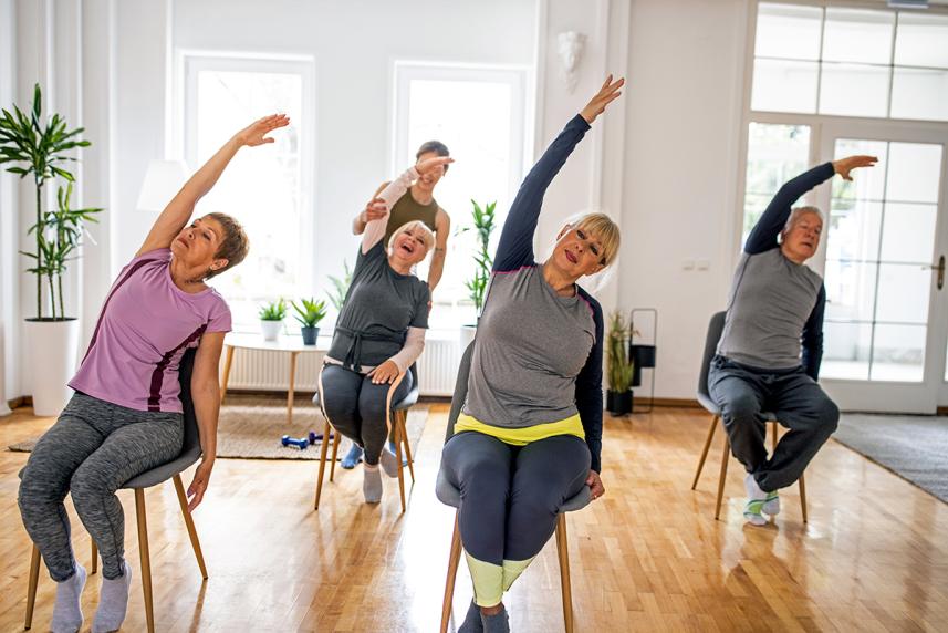 Group of people doing chair yoga