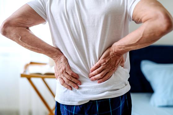 Man holding lower back