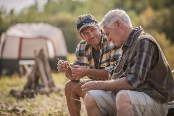 Younger man talking to an older man