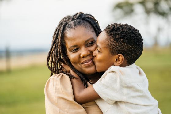 Woman and son hugging 