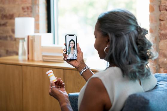 Mature woman on telehealth visit using cell phone